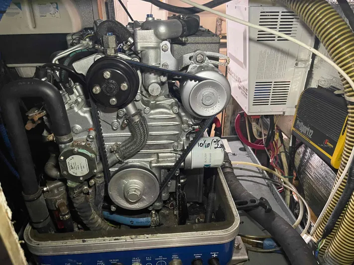 Gratitude Yacht Photos Pics Engine compartment of a 1999 Moody 46 CC sailboat, showcasing mechanical components and wiring.