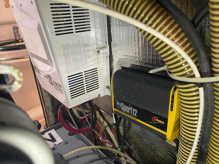 Gratitude Yacht Photos Pics Electrical components inside a 1999 Moody 46 CC yacht, featuring a ProSport12 charger.