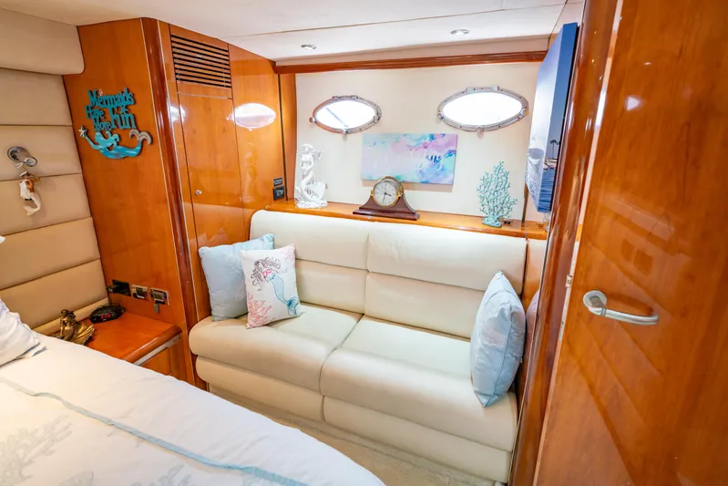 Island Girl Yacht Photos Pics Luxurious interior of 2002 Sunseeker Predator 68 yacht with elegant seating and decor.
