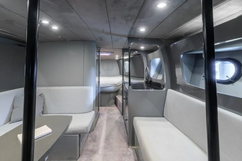  Yacht Photos Pics Interior of a 2003 Magnum 44 yacht with modern seating and sleek design.