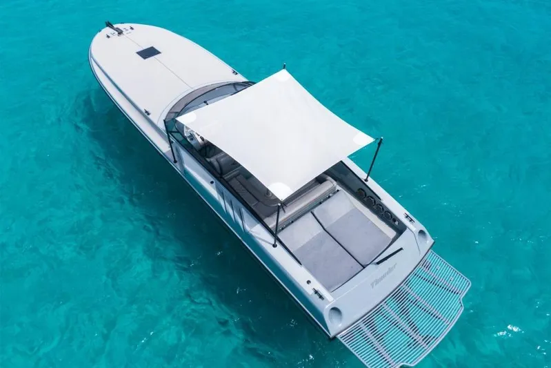  Yacht Photos Pics Aerial view of a 2003 Magnum 44 boat on clear turquoise water.