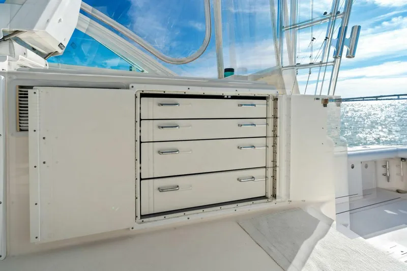 Miss B Havin Yacht Photos Pics 2005 Cabo 40 Express boat interior with storage drawers, ocean view.