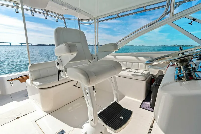 Miss B Havin Yacht Photos Pics Luxurious 2005 Cabo 40 Express yacht interior with helm and seating, ocean view.