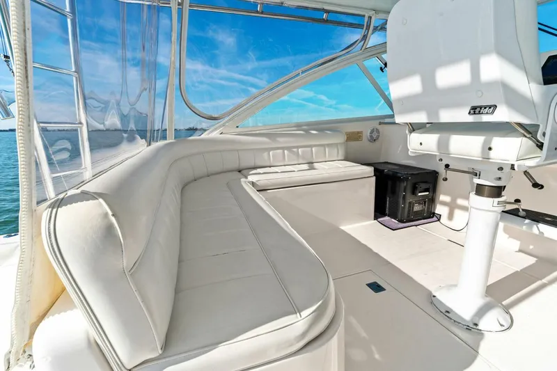 Miss B Havin Yacht Photos Pics 2005 Cabo 40 Express yacht interior with white seating and ocean view.