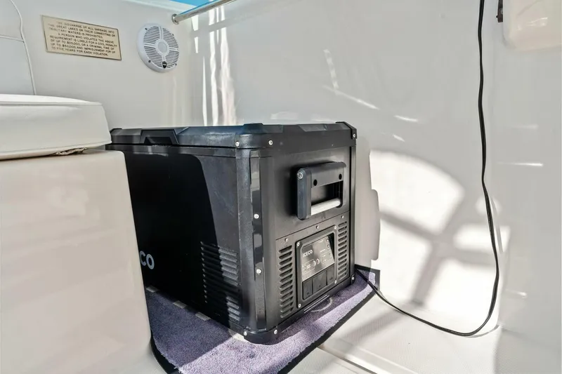 Miss B Havin Yacht Photos Pics 2005 Cabo 40 Express interior with portable cooler and speaker.