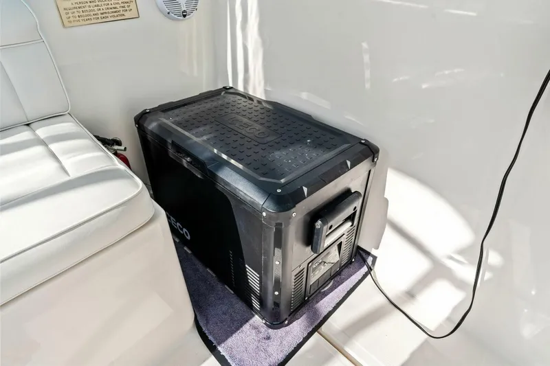 Miss B Havin Yacht Photos Pics Portable cooler on 2005 Cabo 40 Express boat interior, next to white seating.