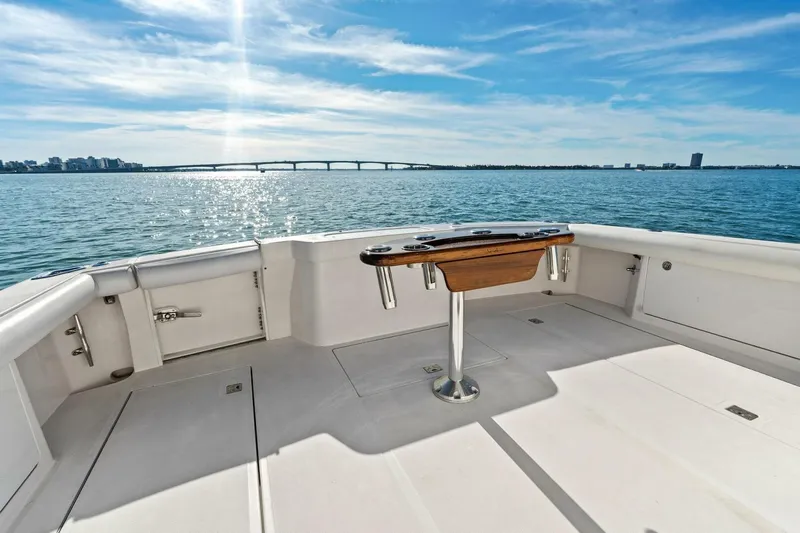 Miss B Havin Yacht Photos Pics 2005 Cabo 40 Express yacht deck with ocean view and city skyline.