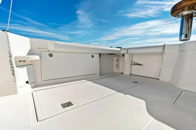 Miss B Havin Yacht Photos Pics 2005 Cabo 40 Express boat deck under clear blue sky.