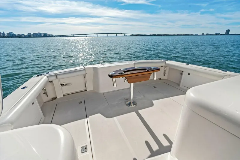 Miss B Havin Yacht Photos Pics 2005 Cabo 40 Express boat deck with ocean view and bridge in background.