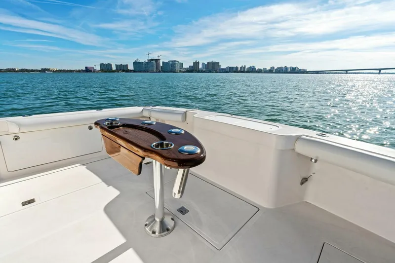 Miss B Havin Yacht Photos Pics 2005 Cabo 40 Express yacht deck with ocean view and city skyline.