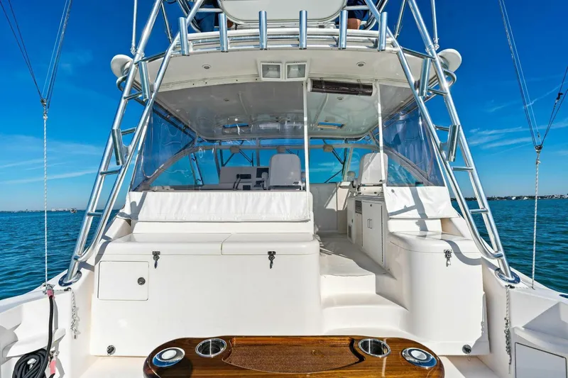 Miss B Havin Yacht Photos Pics 2005 Cabo 40 Express yacht with spacious deck and clear blue sky backdrop.