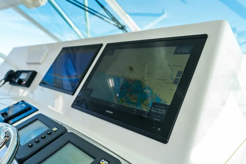 Miss B Havin Yacht Photos Pics Navigation system on 2005 Cabo 40 Express boat dashboard with digital displays.