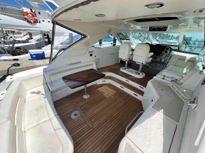  Yacht Photos Pics Luxurious 2010 Sea Ray 540 Sundancer yacht interior with elegant seating and wooden flooring.