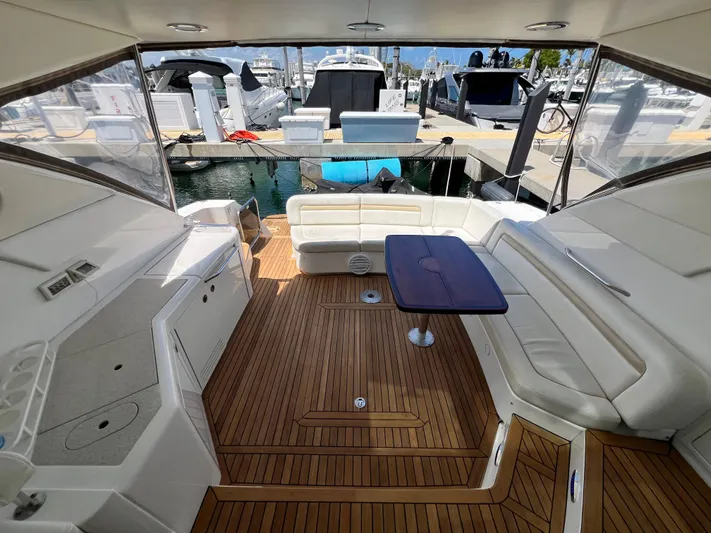  Yacht Photos Pics Luxurious 2010 Sea Ray 540 Sundancer yacht interior with elegant seating and wooden flooring.