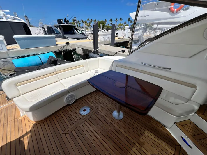  Yacht Photos Pics Luxurious 2010 Sea Ray 540 Sundancer yacht with elegant seating and wooden table on deck.