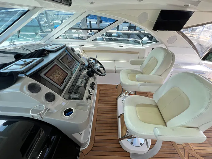  Yacht Photos Pics Luxurious 2010 Sea Ray 540 Sundancer helm with dual seats and advanced navigation system.