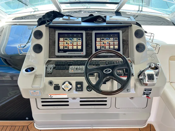  Yacht Photos Pics Helm of 2010 Sea Ray 540 Sundancer with dual screens and steering wheel.
