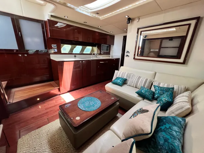  Yacht Photos Pics Luxurious interior of 2010 Sea Ray 540 Sundancer yacht with elegant seating and modern kitchen.