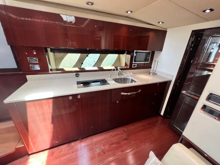  Yacht Photos Pics Luxurious kitchen interior of 2010 Sea Ray 540 Sundancer yacht with modern amenities.