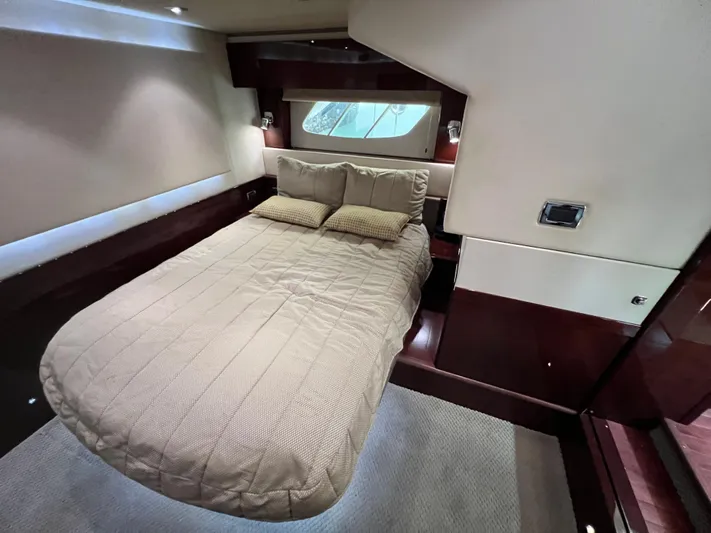  Yacht Photos Pics Luxurious bedroom interior of 2010 Sea Ray 540 Sundancer yacht with elegant bedding.