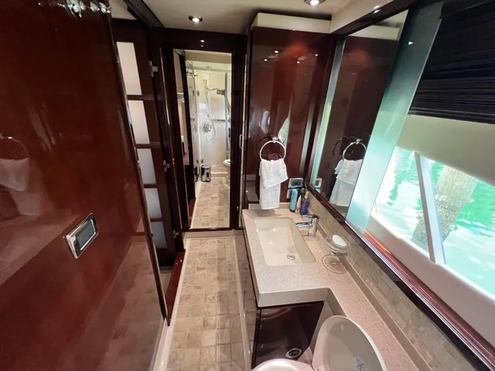  Yacht Photos Pics Luxurious bathroom interior of 2010 Sea Ray 540 Sundancer yacht with elegant wood finishes.