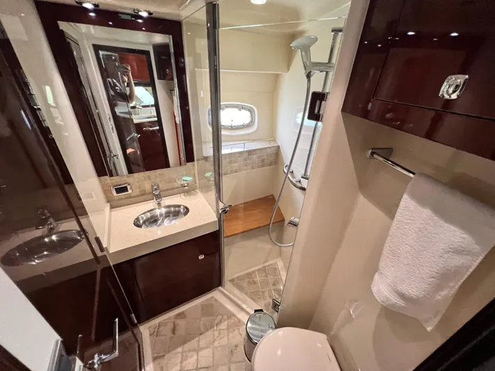  Yacht Photos Pics Luxurious bathroom in 2010 Sea Ray 540 Sundancer yacht with modern fixtures and elegant design.