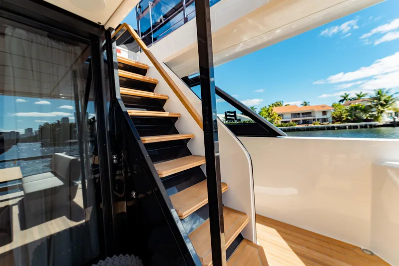  Yacht Photos Pics Staircase on 2023 Ferretti Yachts 860, with scenic waterfront view.
