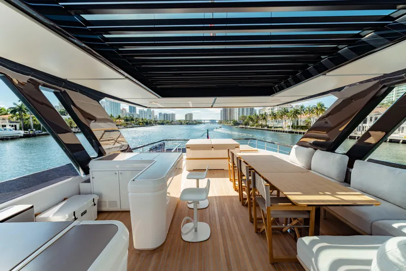  Yacht Photos Pics Luxurious 2023 Ferretti Yachts 860 interior with elegant seating and scenic waterway view.