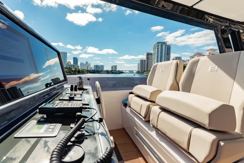  Yacht Photos Pics Luxurious 2023 Ferretti Yachts 860 interior with city skyline view.