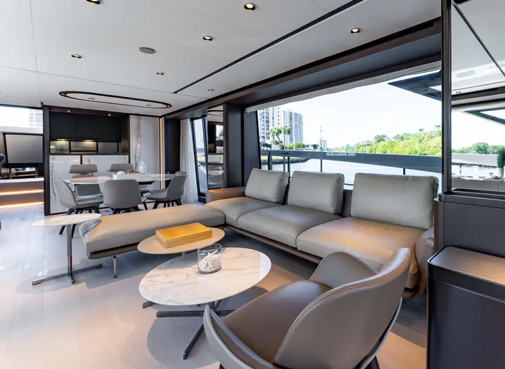  Yacht Photos Pics Luxurious interior of 2023 Ferretti Yachts 860 with modern seating and large windows.