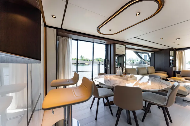  Yacht Photos Pics Luxurious interior of 2023 Ferretti Yachts 860, featuring elegant dining and seating areas.