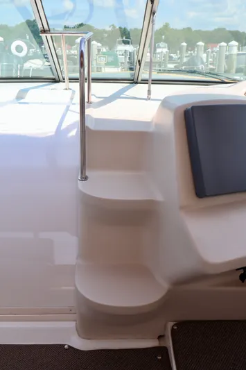Entourage Yacht Photos Pics Staircase on a 2000 Cruisers Yachts 3870 with stainless steel railing.