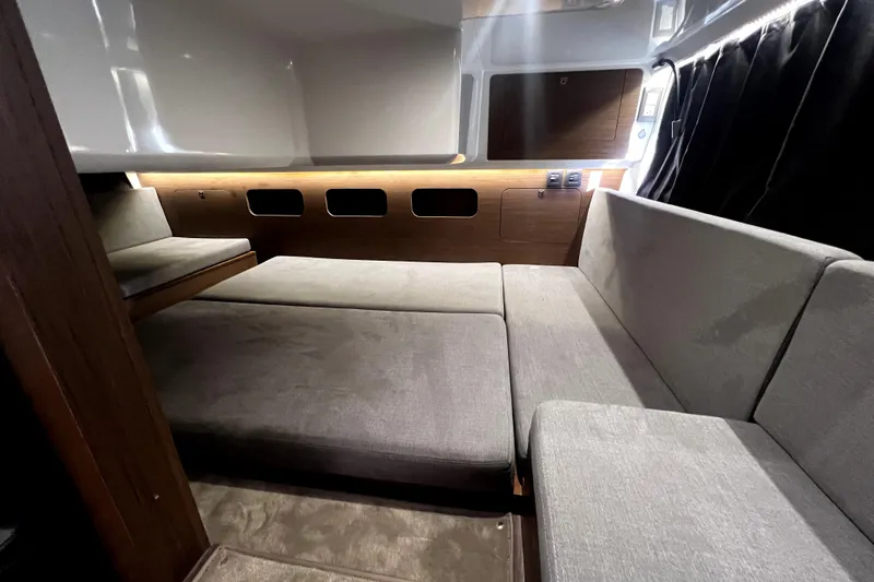  Yacht Photos Pics Interior of 2023 Beneteau Antares 11 Fly, featuring modern seating and ambient lighting.