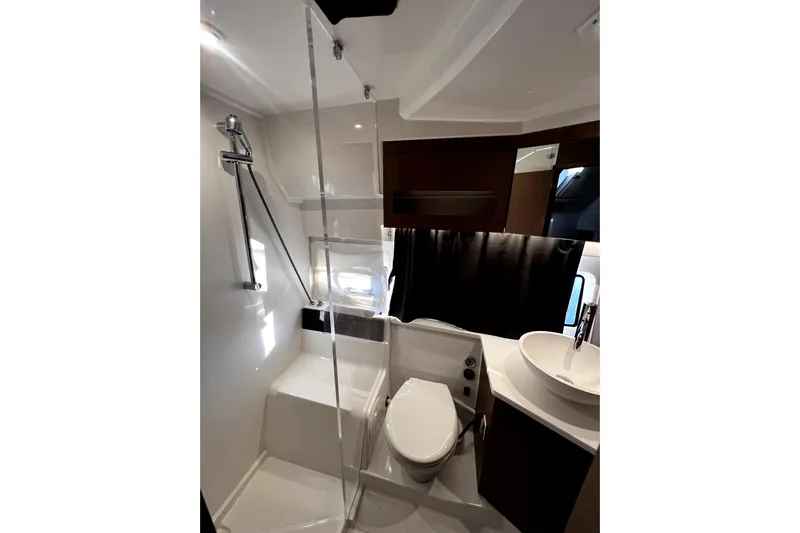  Yacht Photos Pics Modern bathroom in 2023 Beneteau Antares 11 Fly yacht with shower and sink.