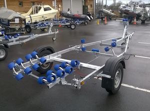 2021 Extreme Boats 1100s swing, braked easy roller boat trailer