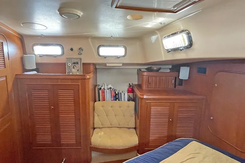  Yacht Photos Pics Luxurious 2005 Island Packet 485 yacht interior with wood cabinetry and cozy seating.