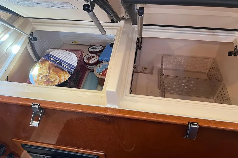  Yacht Photos Pics Freezer compartments on 2005 Island Packet 485 yacht, stocked with ice cream and frozen goods.