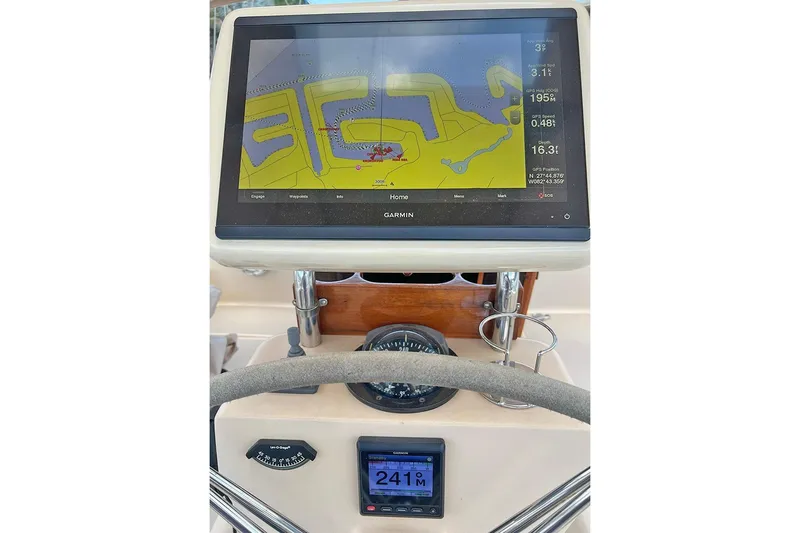  Yacht Photos Pics Navigation system on 2005 Island Packet 485 sailboat, featuring Garmin display and compass.