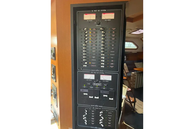  Yacht Photos Pics Electrical panel inside 2005 Island Packet 485 yacht, showcasing 12V DC and 120V AC systems.