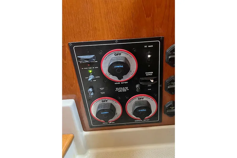  Yacht Photos Pics Control panel of a 2005 Island Packet 485 yacht, featuring battery switches and charger output.