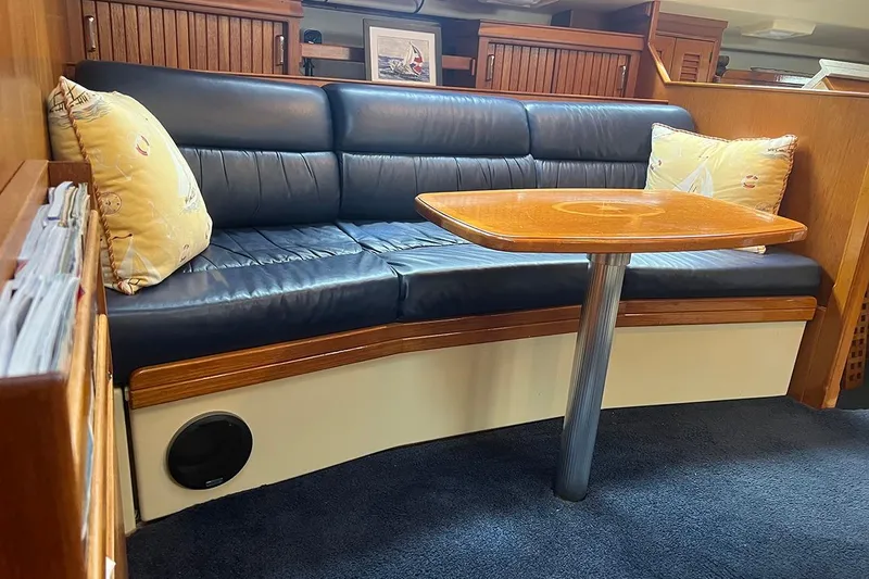  Yacht Photos Pics Luxurious interior of 2005 Island Packet 485 yacht with leather seating and wooden table.
