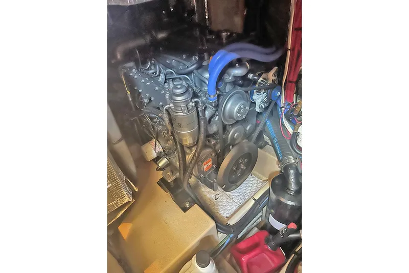  Yacht Photos Pics Engine compartment of a 2005 Island Packet 485 sailboat, showcasing mechanical components.