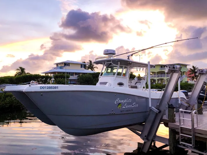  Yacht Photos Pics 2018 World Cat 320 CC boat docked at sunset with scenic background.