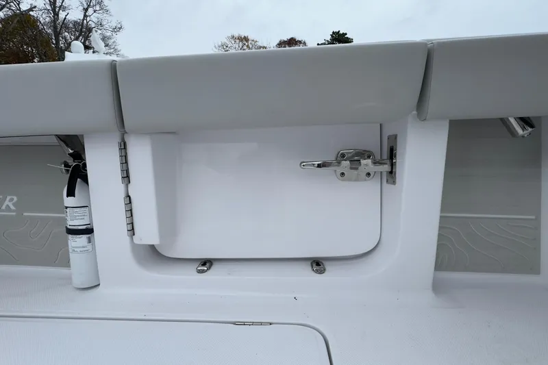  Yacht Photos Pics 2024 Jupiter 32 FS boat interior with safety equipment and storage compartment.