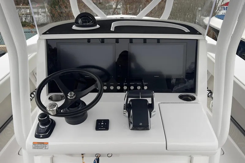  Yacht Photos Pics 2024 Jupiter 32 FS boat dashboard with dual screens, steering wheel, and controls.