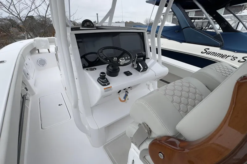  Yacht Photos Pics 2024 Jupiter 32 FS boat cockpit with modern steering and controls.