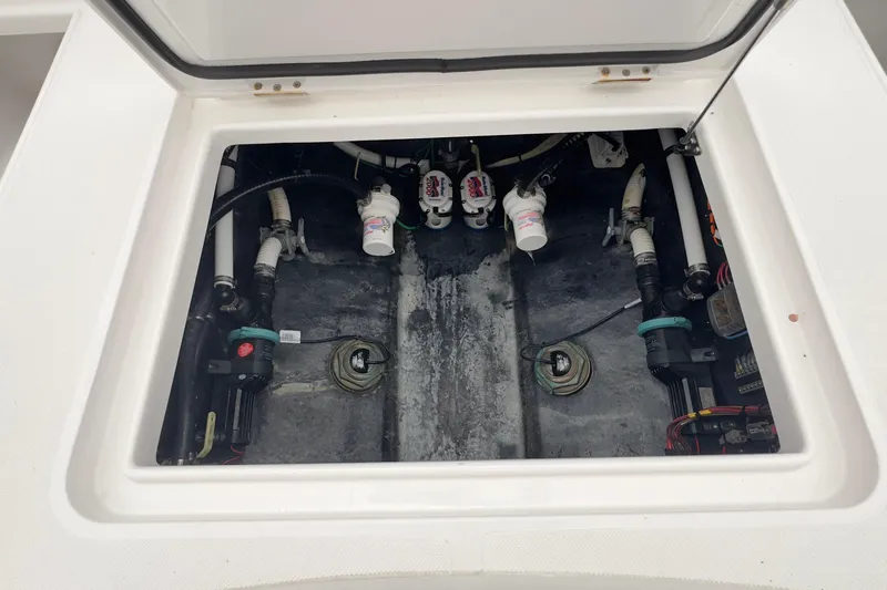  Yacht Photos Pics 2024 Jupiter 32 FS boat compartment with visible plumbing and mechanical components.