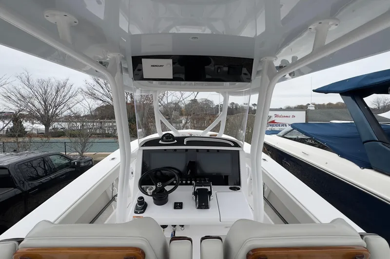  Yacht Photos Pics 2024 Jupiter 32 FS boat cockpit with modern steering and navigation system.