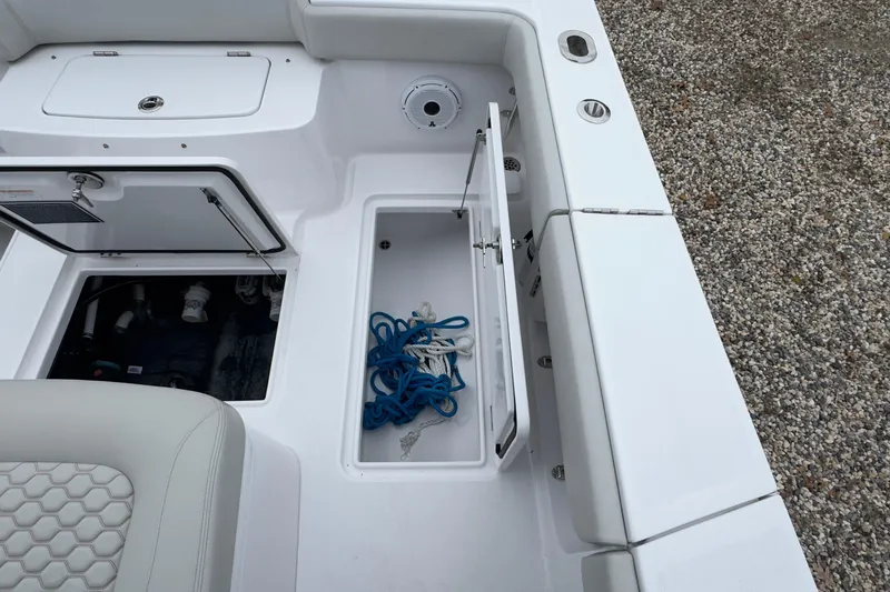  Yacht Photos Pics 2024 Jupiter 32 FS boat storage compartments with ropes and seating detail.