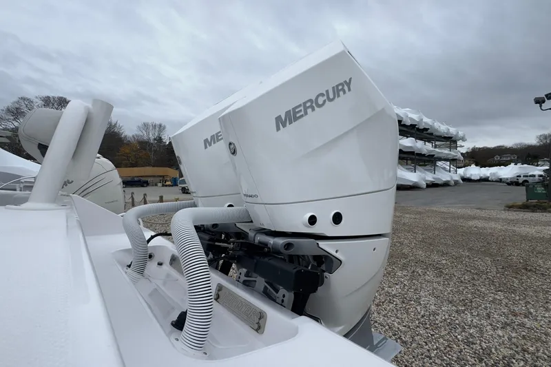  Yacht Photos Pics 2024 Jupiter 32 FS boat with Mercury outboard engines in a marina setting.
